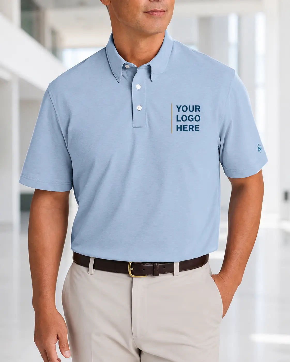 Male model wearing a custom Brooks Brothers BB18222 Newport Blue polo with left-chest DTF logo placement.
