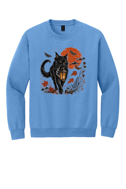 Black cat carrying glowing lantern Halloween crewneck sweatshirt with harvest moon moths and autumn botanicals, DTF print in Carolina Blue