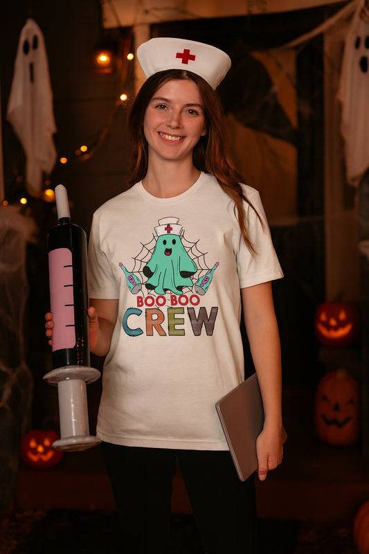 Boo Boo Crew Halloween nurse ghost graphic tee printed on BELLA+CANVAS 3001 unisex short sleeve shirt worn by a model