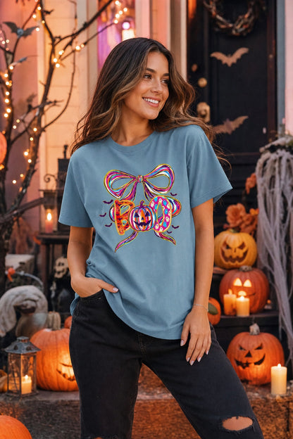 BOO Halloween graphic unisex tee with jack-o'-lantern, ghosts, bats and ribbon bow – BELLA+CANVAS 3001 worn by a model