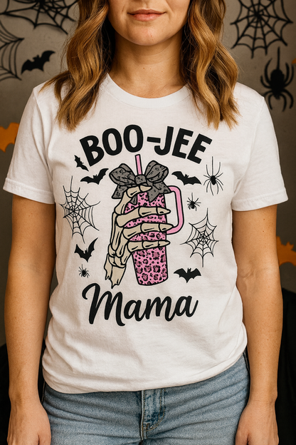 BOO-JEE Mama Halloween unisex tee with skeleton hand holding pink leopard tumbler, bats and spiders, BELLA+CANVAS 3001 worn by a model