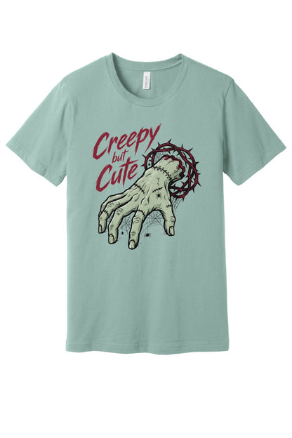 Creepy but Cute zombie hand thorn crown spiderweb Halloween graphic tee on white shirt in Dusty Blue