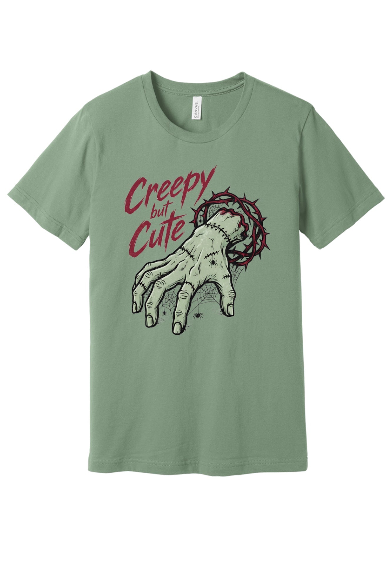 Creepy but Cute zombie hand thorn crown spiderweb Halloween graphic tee on white shirt in Sage