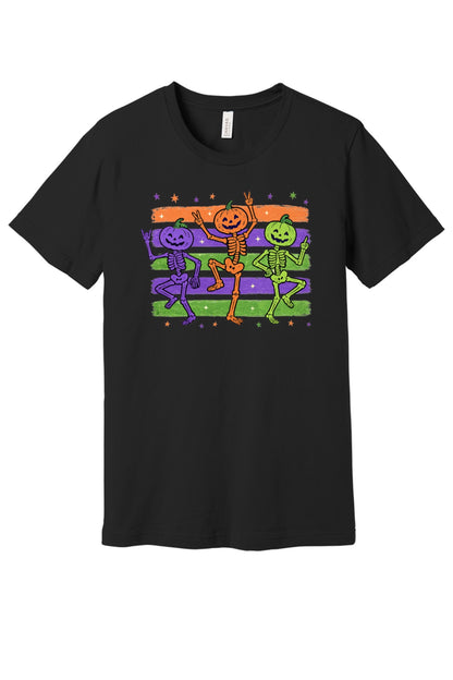Dancing pumpkin head skeletons Halloween unisex tee in purple orange and green on striped background in Black