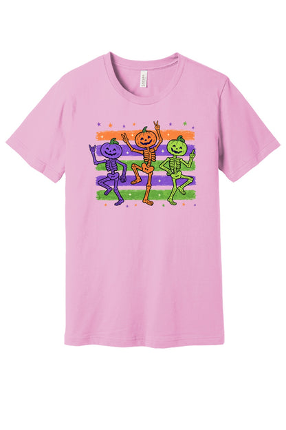 Dancing pumpkin head skeletons Halloween unisex tee in purple orange and green on striped background in Lilac