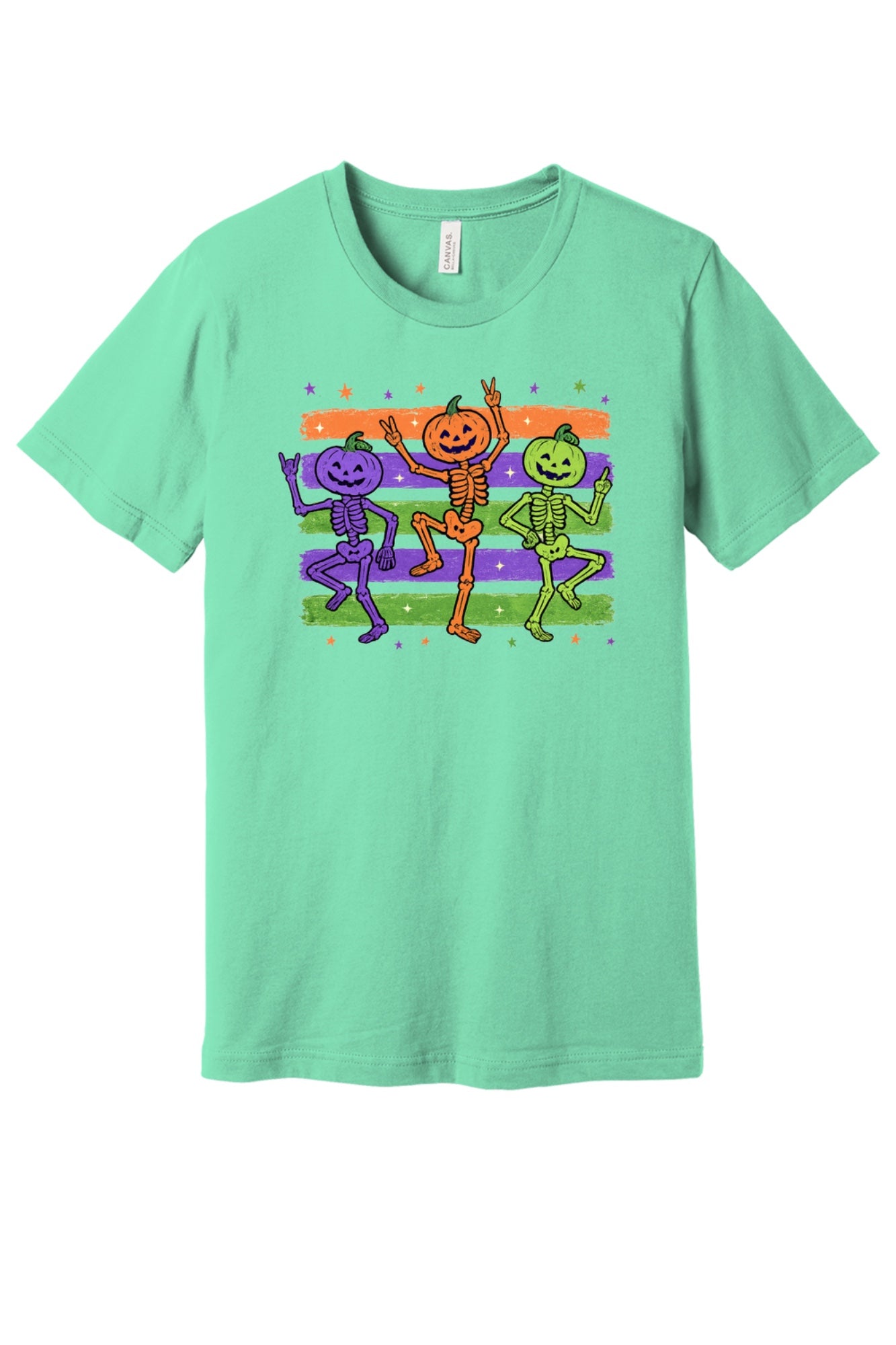 Dancing pumpkin head skeletons Halloween unisex tee in purple orange and green on striped background in Mint