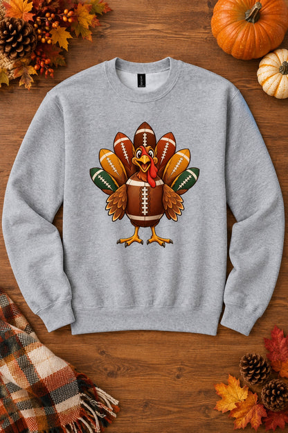 Football turkey cartoon crewneck sweatshirt DTF printed Thanksgiving design on Gildan 18000, styled flat lay, no model