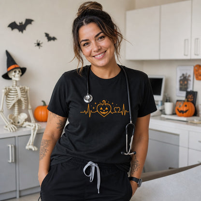 Halloween heartbeat jack-o-lantern pumpkin heart EKG graphic printed on Comfort Colors heavyweight tee, worn by a model