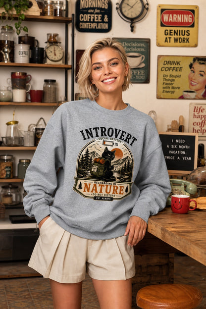 Introvert Social Battery 1% Recharging in Nature printed crewneck sweatshirt with grumpy cat hiker design worn by a model