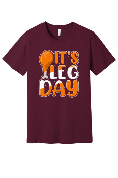 IT'S LEG DAY funny Thanksgiving drumstick graphic printed on a BELLA+CANVAS unisex tee in Maroon