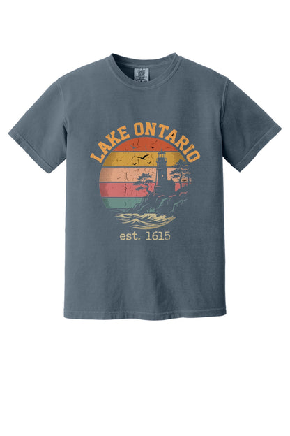Lake Ontario est. 1615 retro lighthouse sunset graphic printed on a Comfort Colors heavyweight tee in Denim
