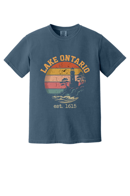 Lake Ontario est. 1615 retro lighthouse sunset graphic printed on a Comfort Colors heavyweight tee in Midnight