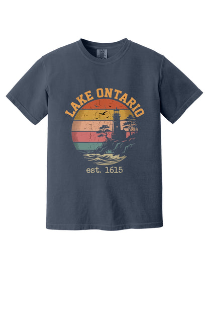 Lake Ontario est. 1615 retro lighthouse sunset graphic printed on a Comfort Colors heavyweight tee in Navy
