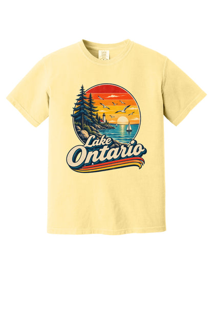 Lake Ontario vintage sunset lighthouse graphic tee with sailboats and seagulls, bold retro script design in Butter