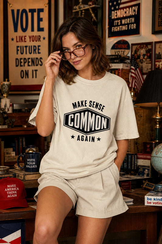 Make Sense Common Again black and white badge graphic printed on Comfort Colors heavyweight tee worn by a model