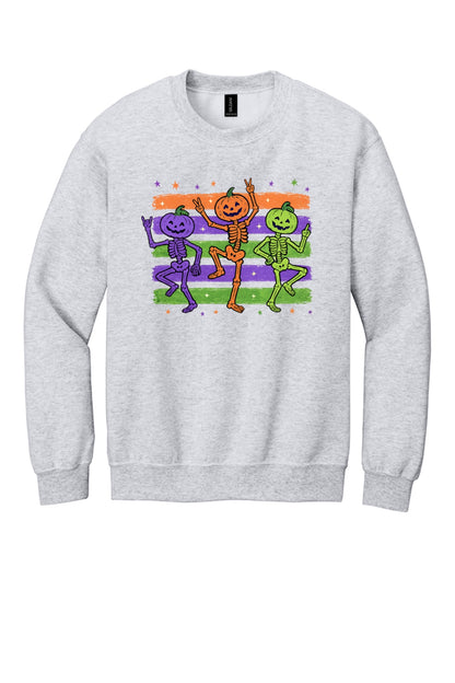 Dancing pumpkin head skeleton trio Halloween crewneck sweatshirt in purple orange and green on white in Ash
