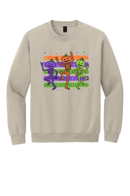 Dancing pumpkin head skeleton trio Halloween crewneck sweatshirt in purple orange and green on white in Sand