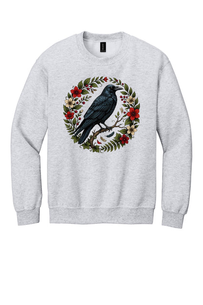Raven perched on branch inside red floral botanical wreath, printed on a Halloween crewneck sweatshirt in Ash