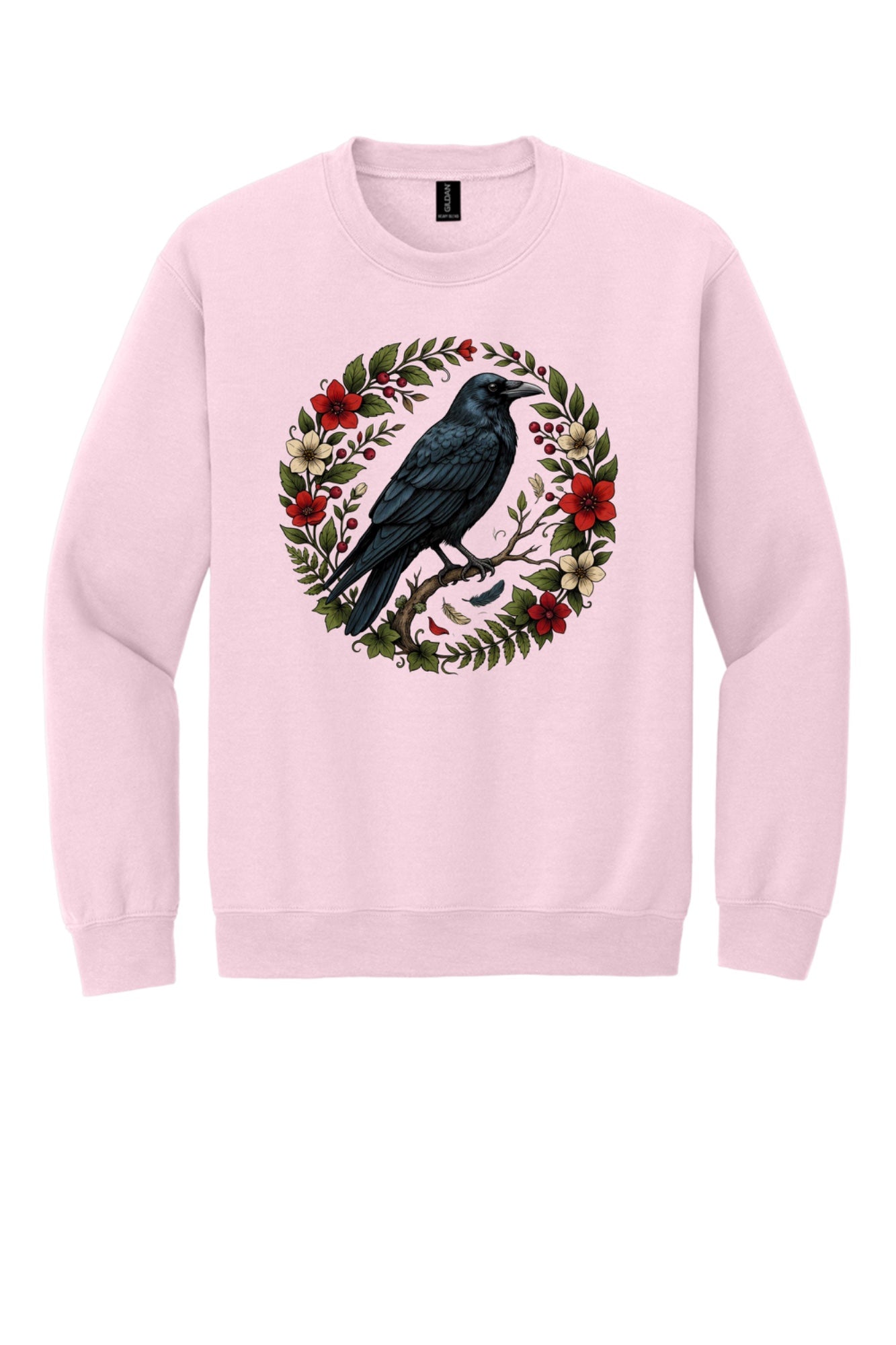 Raven perched on branch inside red floral botanical wreath, printed on a Halloween crewneck sweatshirt in Light Pink