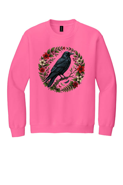 Raven perched on branch inside red floral botanical wreath, printed on a Halloween crewneck sweatshirt in Safety Pink