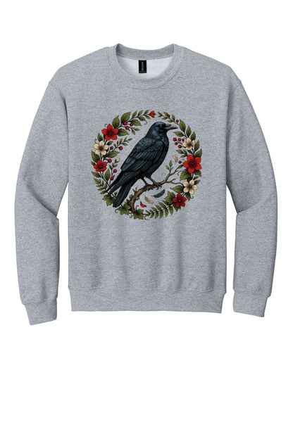 Raven perched on branch inside red floral botanical wreath, printed on a Halloween crewneck sweatshirt in Sport Grey