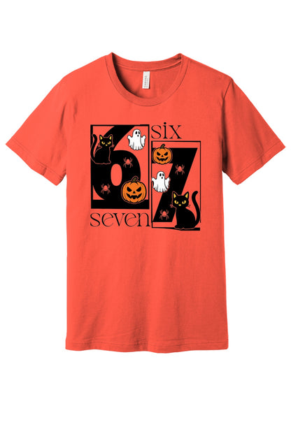 Six Seven Halloween tee with black cats ghosts pumpkins and spiders printed on a unisex short sleeve shirt in Coral