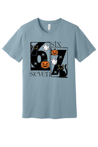 Six Seven Halloween tee with black cats ghosts pumpkins and spiders printed on a unisex short sleeve shirt in Denim