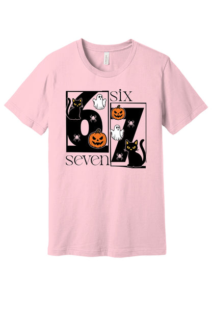 Six Seven Halloween tee with black cats ghosts pumpkins and spiders printed on a unisex short sleeve shirt in Pink