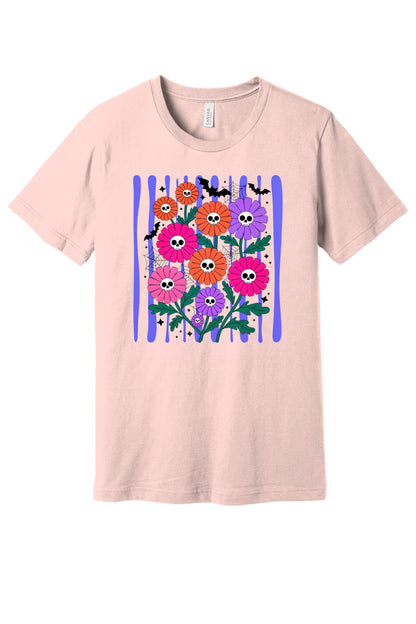 Skull gerbera daisy bouquet with bats and spider webs Halloween graphic tee in orange pink and purple in Soft Pink