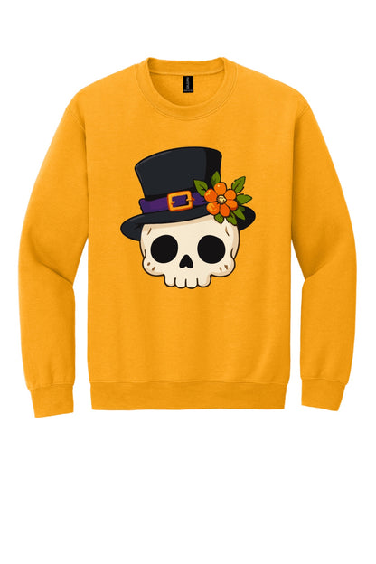 Halloween skull in black top hat with orange marigold printed on a Gildan crewneck sweatshirt in Gold