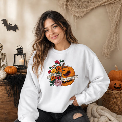 Sorta Sweet Sorta Spooky floral jack-o-lantern Halloween crewneck sweatshirt printed on Sand, worn by a model