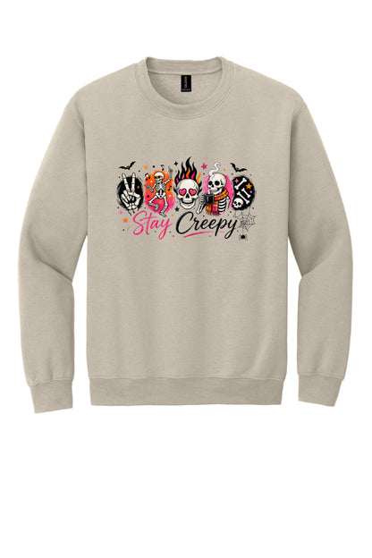 Stay Creepy skeleton Halloween crewneck sweatshirt with flaming skull and heart-eyes DTF print, Gildan 18000 in Sand