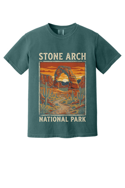 Stone Arch National Park printed tee, retro red rock arch and cactus sunset design on garment-dyed cotton shirt in Blue Spruce