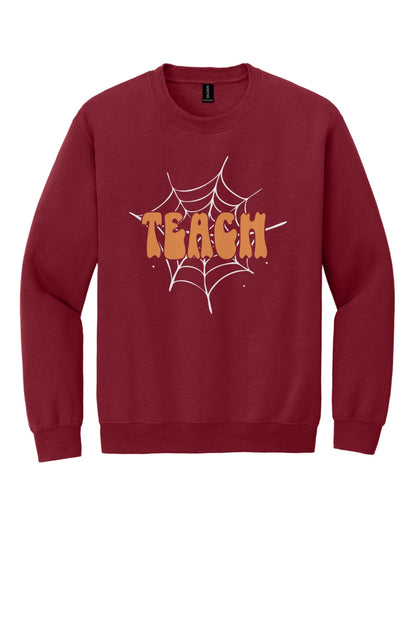 Teach groovy retro bubble letter Halloween crewneck sweatshirt, warm orange DTF print on dark fabric in Cardinal Red