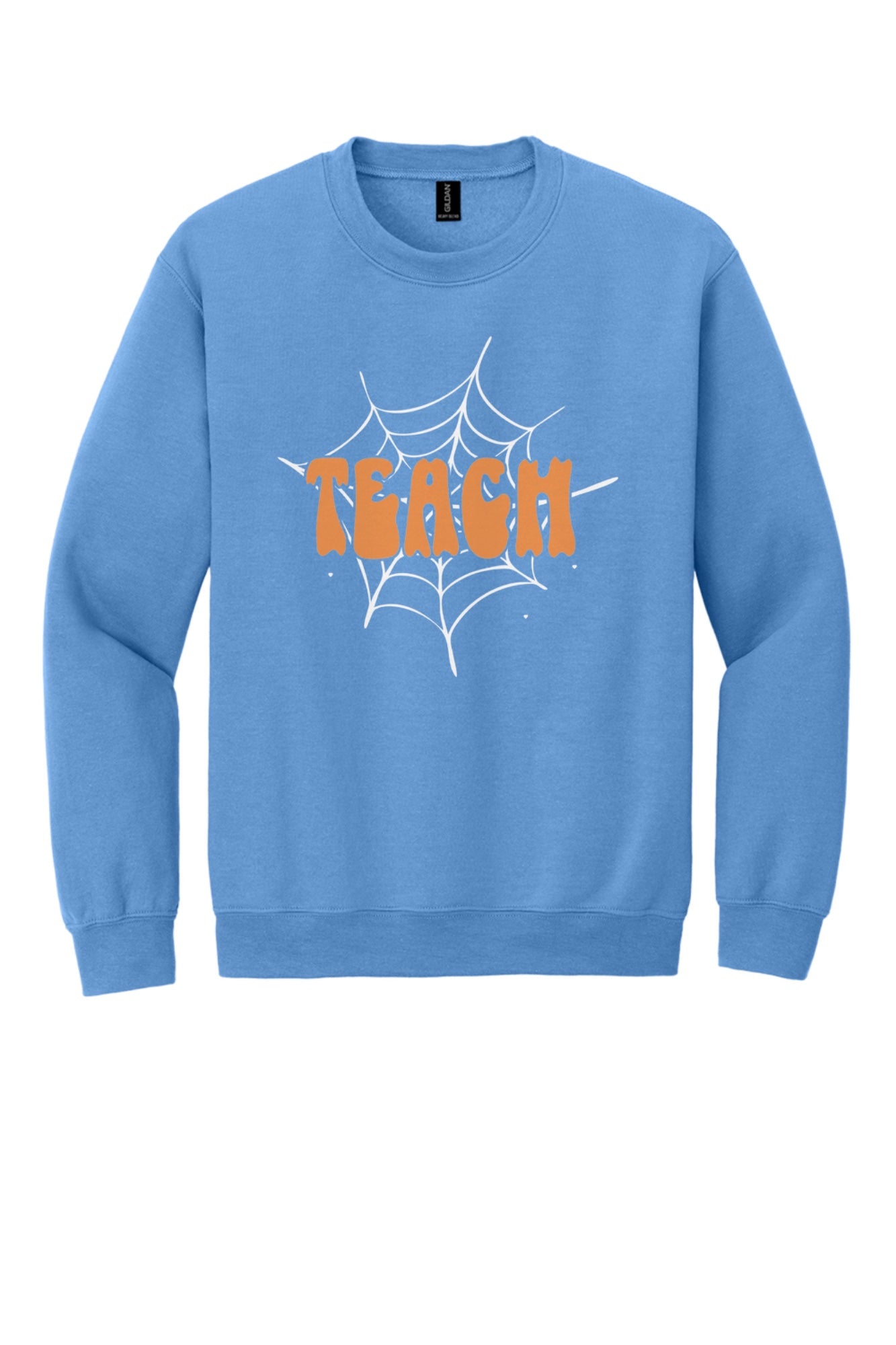 Teach groovy retro bubble letter Halloween crewneck sweatshirt, warm orange DTF print on dark fabric in Carolina Blue