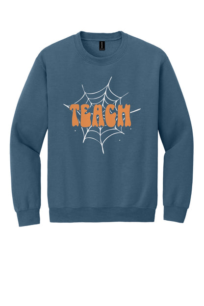 Teach groovy retro bubble letter Halloween crewneck sweatshirt, warm orange DTF print on dark fabric in Indigo Blue