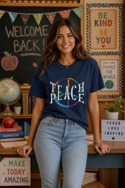 Teach Peace multi-color brushstroke peace sign printed on a Comfort Colors heavyweight tee worn by a model