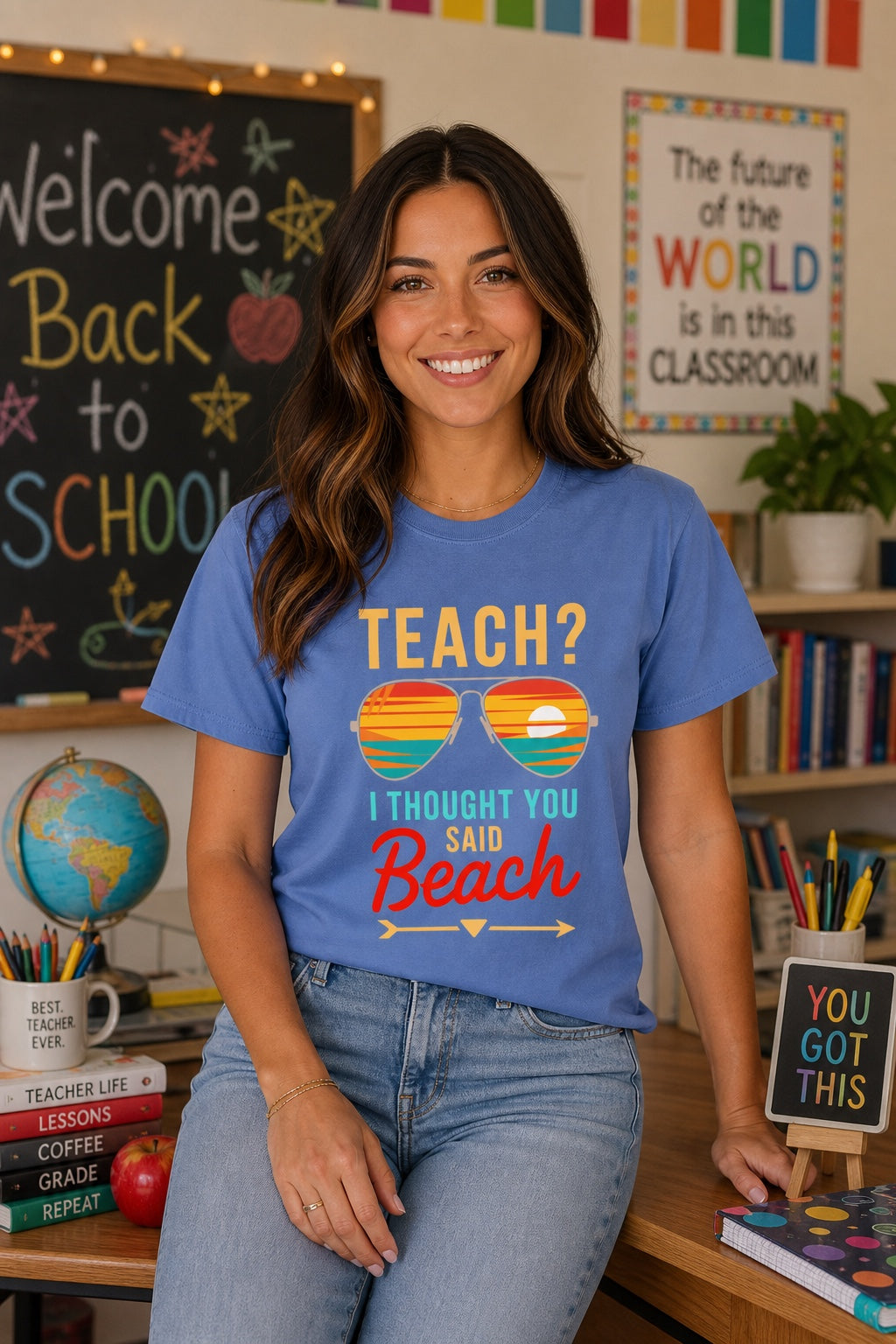 Teach I Thought You Said Beach printed teacher tee with retro aviator sunglasses sunset graphic worn by a model
