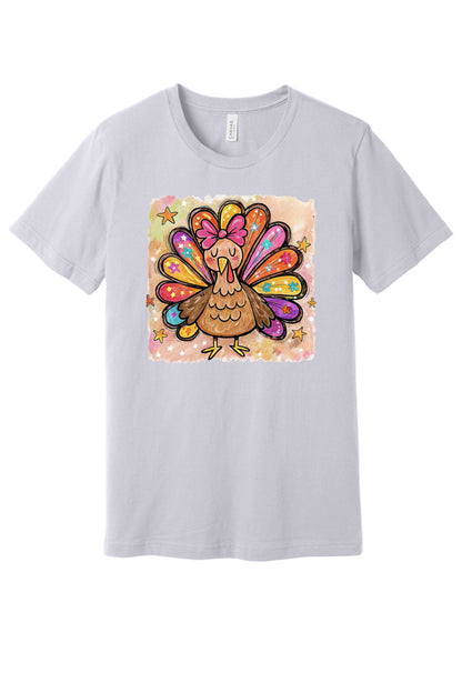 Colorful thanksgiving girl turkey pink bow watercolor tee printed on BELLA+CANVAS unisex short sleeve shirt in Lavender Dust