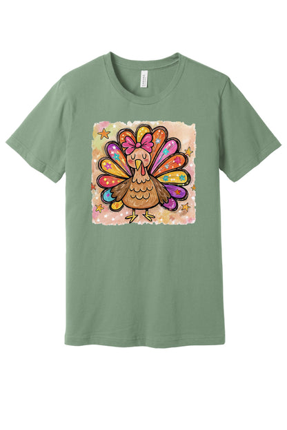 Colorful thanksgiving girl turkey pink bow watercolor tee printed on BELLA+CANVAS unisex short sleeve shirt in Sage