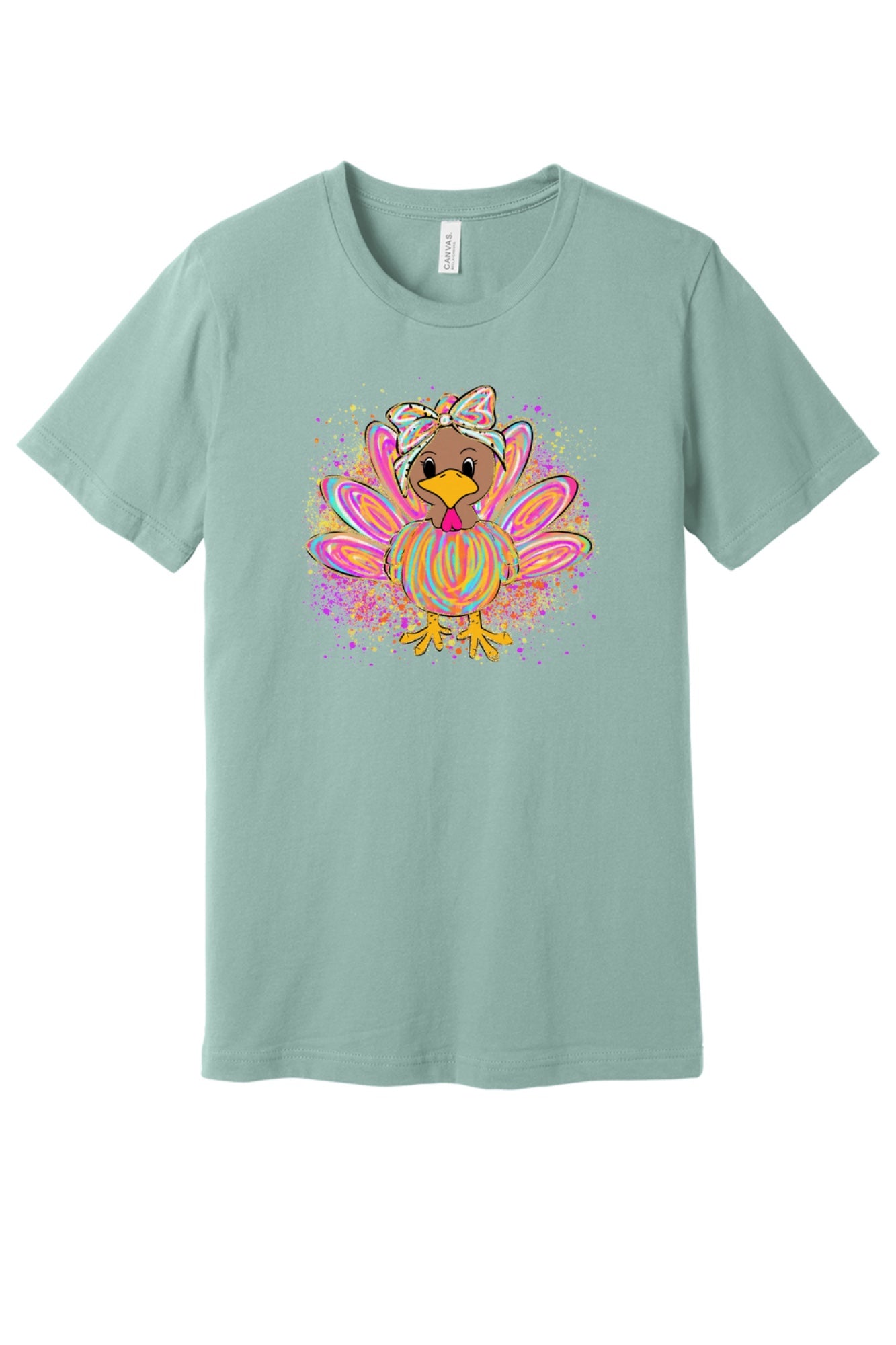 Colorful cartoon girl turkey with bow and tie-dye swirl feathers printed on a unisex Thanksgiving tee in Dusty Blue