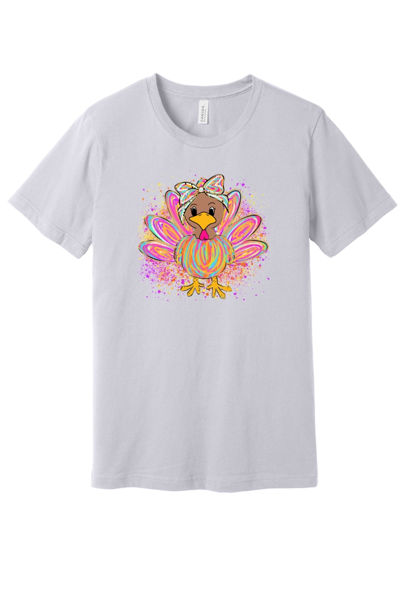 Colorful cartoon girl turkey with bow and tie-dye swirl feathers printed on a unisex Thanksgiving tee in Lavender Dust