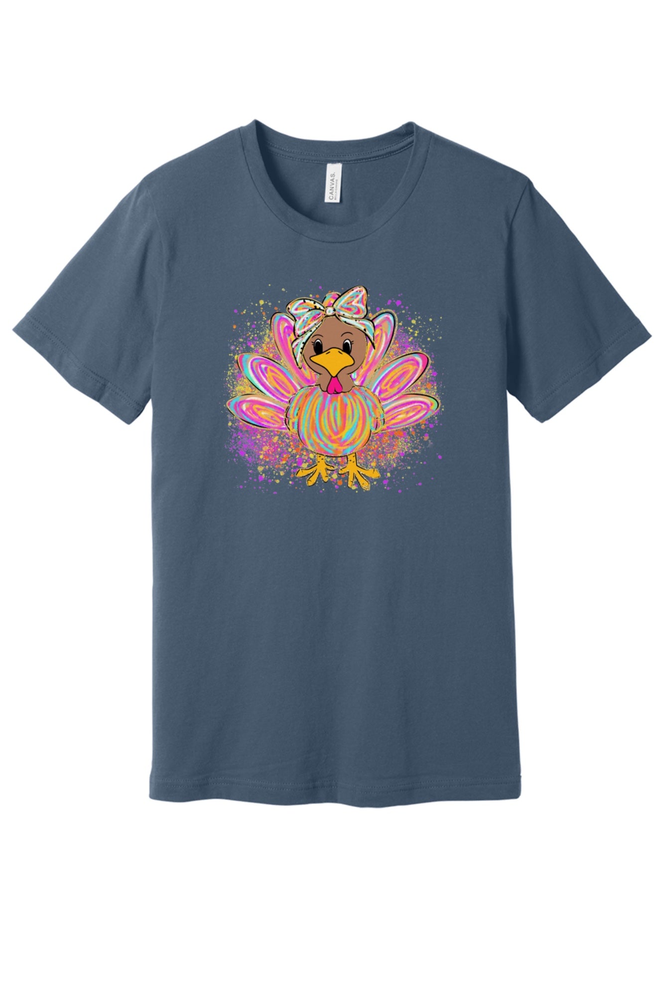 Colorful cartoon girl turkey with bow and tie-dye swirl feathers printed on a unisex Thanksgiving tee in Slate