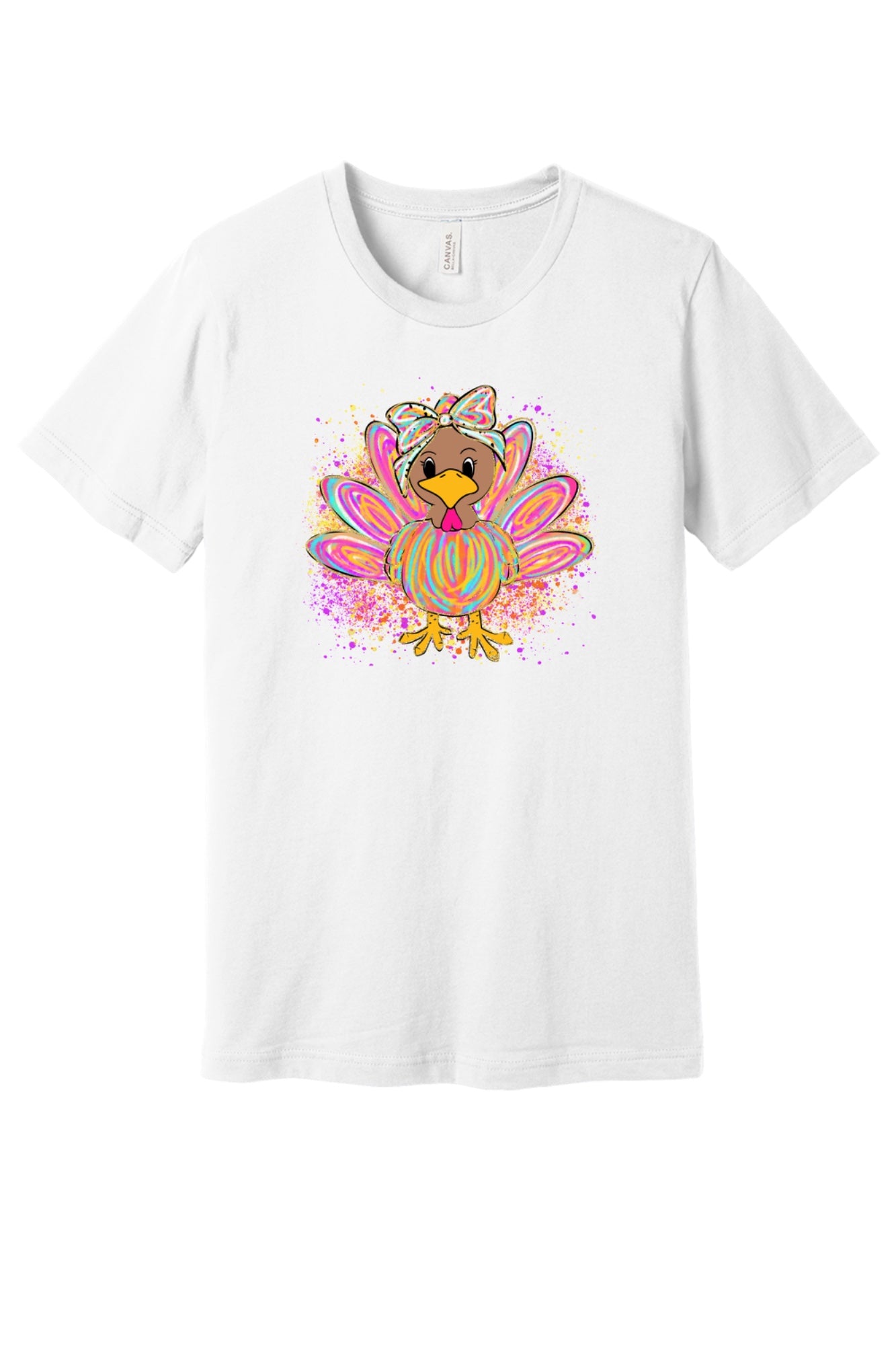 Colorful cartoon girl turkey with bow and tie-dye swirl feathers printed on a unisex Thanksgiving tee in White