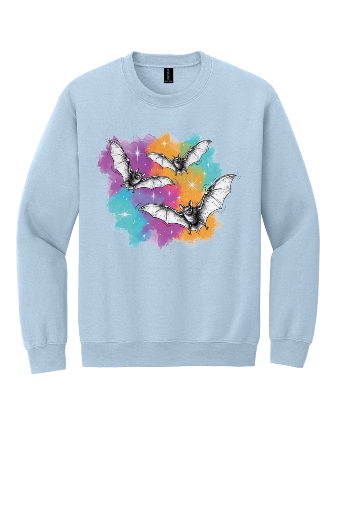 Gildan 18000 crewneck sweatshirt with three sketch-style flying bats over a watercolor purple teal orange sparkle Halloween print in Light Blue