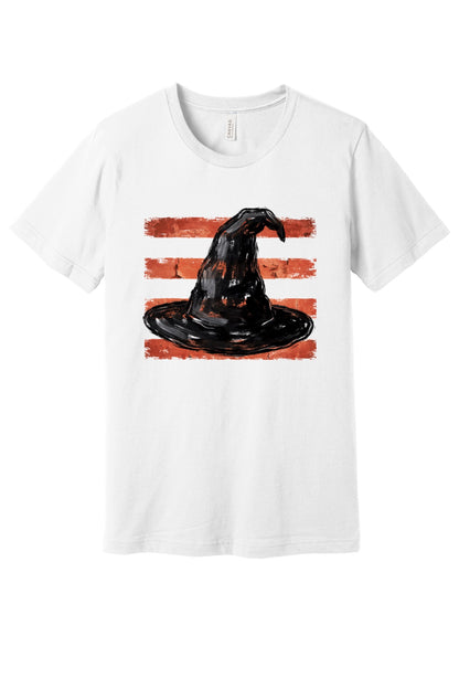 Black brushstroke witch hat on burnt-orange stripe Halloween graphic tee, DTF print, unisex cotton in White