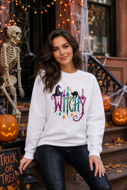 Witchy Halloween crewneck sweatshirt with witch hat, black cat, potion bottles and gold star charm print worn by a model