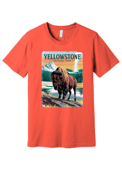 Yellowstone National Park vintage bison poster graphic tee printed on a BELLA+CANVAS 3001 unisex short sleeve shirt in Coral