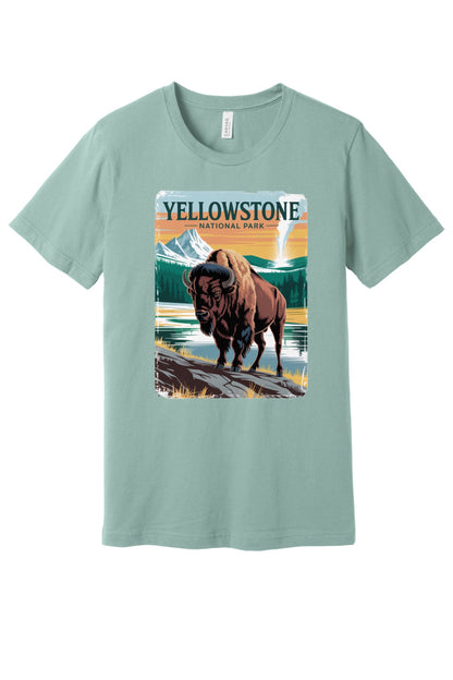 Yellowstone National Park vintage bison poster graphic tee printed on a BELLA+CANVAS 3001 unisex short sleeve shirt in Dusty Blue